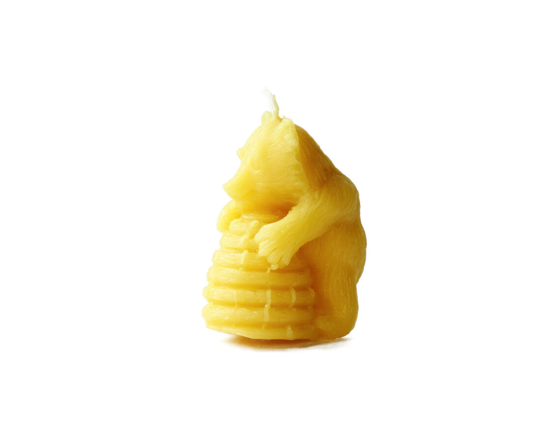 Beeswax candle-bear on a hive