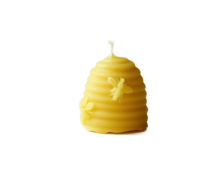Beeswax candle-hive with bees